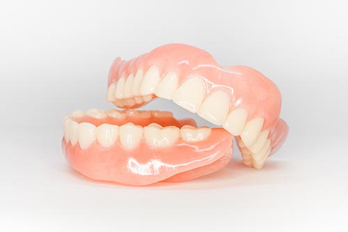 Complete upper and lower dentures.